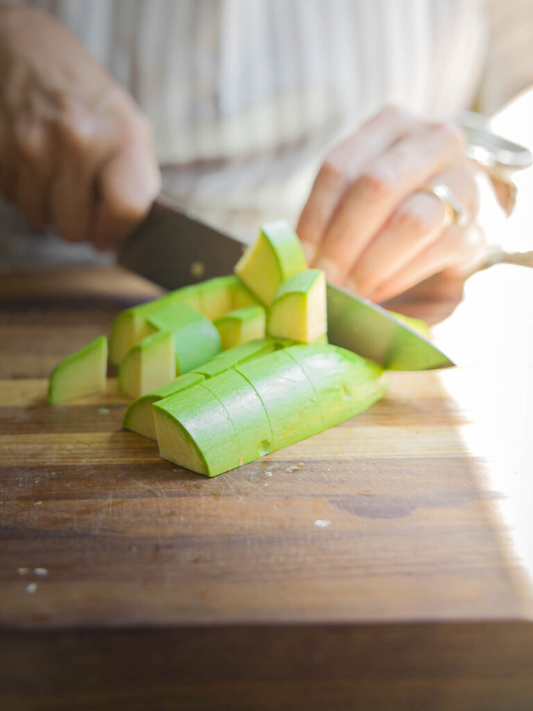 chopping up zucchini